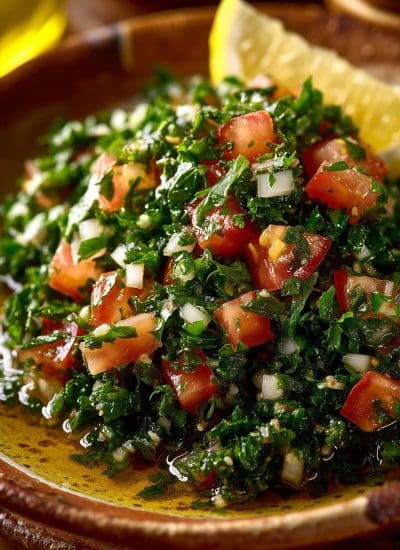 Tabouli Salad Extreme macro of vibrant tabouli salad in a shallow, hand-glazed ceramic bowl